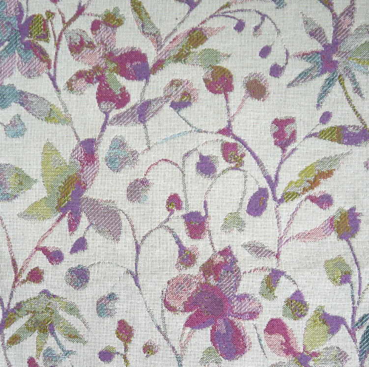 Amble Floral Jacquard Lilac fabric featuring an intricate woven floral pattern in lilac, green, and pink tones. Ideal for interior decor projects.