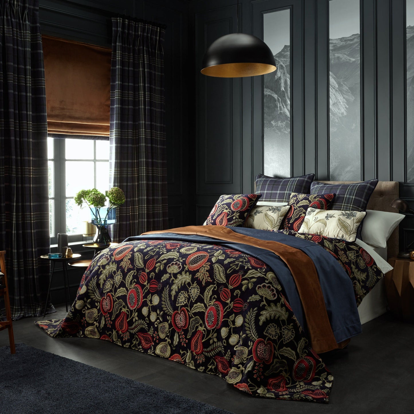 Luxurious bedroom décor showcasing Orchard Indigo fabric as a duvet cover with matching curtains, blending nature-inspired patterns with elegance.