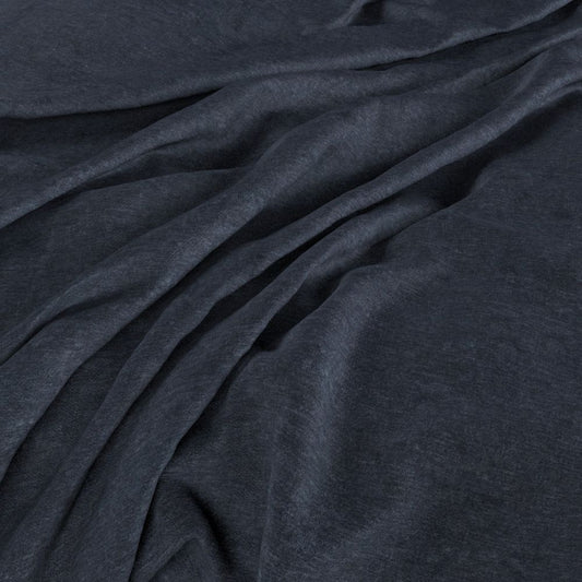 Draped Aurea Chenille Navy fabric showcasing its rich navy tone and smooth, washable chenille texture for elegant crafting.