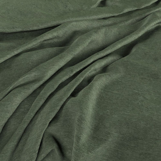 Draped Aurea Chenille Thyme fabric showcasing its soft texture and elegant green hue, perfect for crafting and interior design.