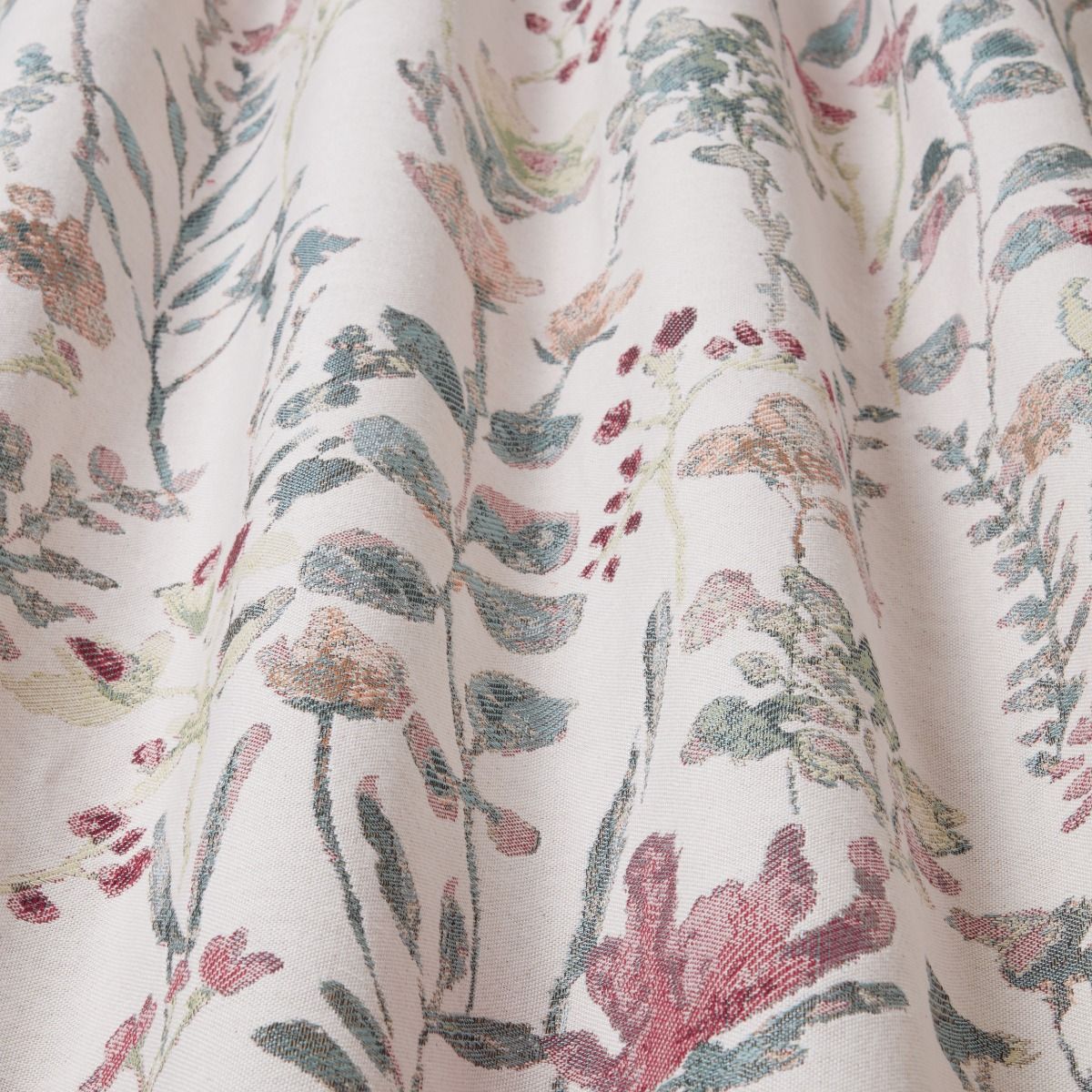 Close-up of Floral Croft Eucalyptus fabric showcasing its heavyweight tapestry weave and intricate floral design in natural hues.