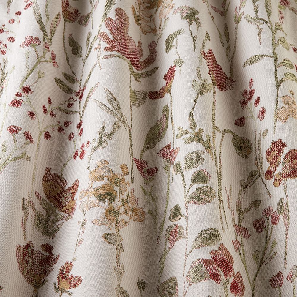 Close-up of Floral Croft Rosewood fabric highlighting its intricate red and green floral jacquard design on a soft neutral base.