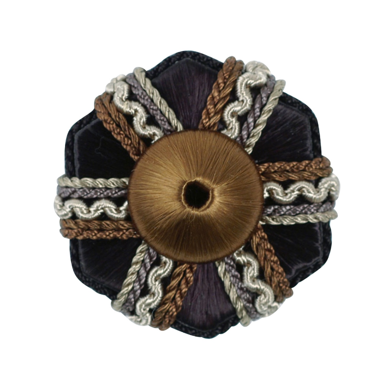 Decorative black rosette with brown centre and braided trim on a white background