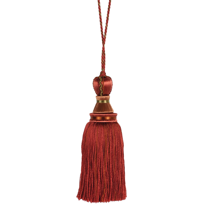 Red key tassel with a bronze cap on a white background