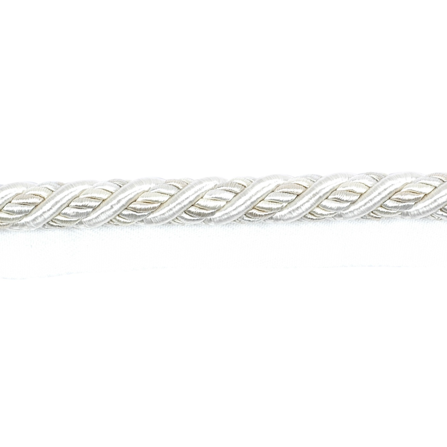 Close-up of a silver braided piping cord on a white background