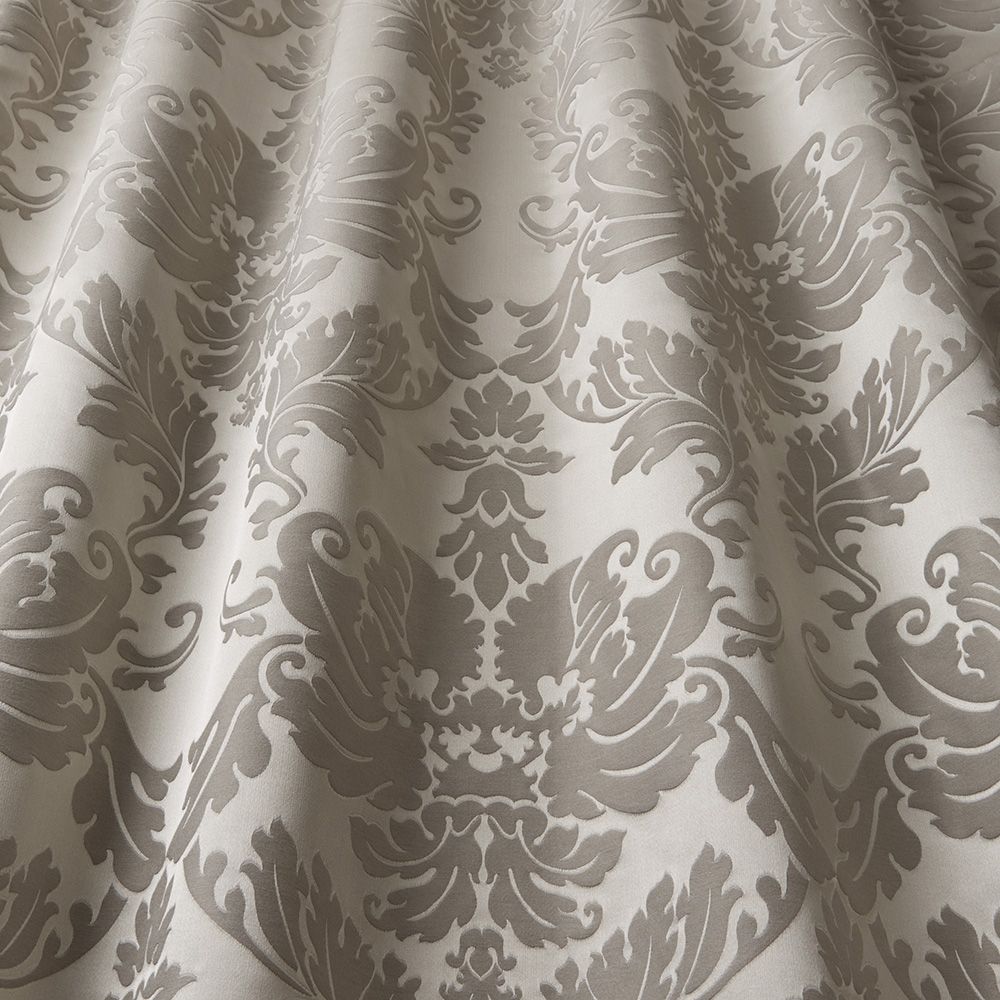 Close-up of Renaissance Fia Damask fabric in pewter, showcasing detailed damask patterns and soft texture for premium upholstery.