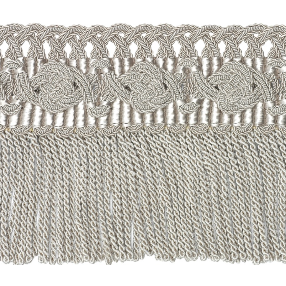 Decorative lace trim with intricate patterns on a textured fabric background
