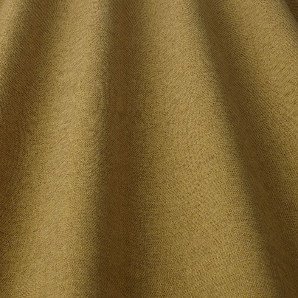 Glenmore Plain Mustard fabric showcasing a smooth drape and soft texture, perfect for durable and stain-resistant upholstery projects.