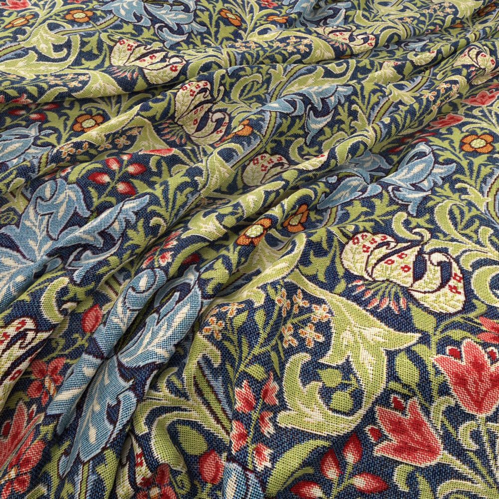 Close-up of William Morris Golden Lily Blue Mist Jacquard fabric showcasing detailed floral designs and textured upholstery material.