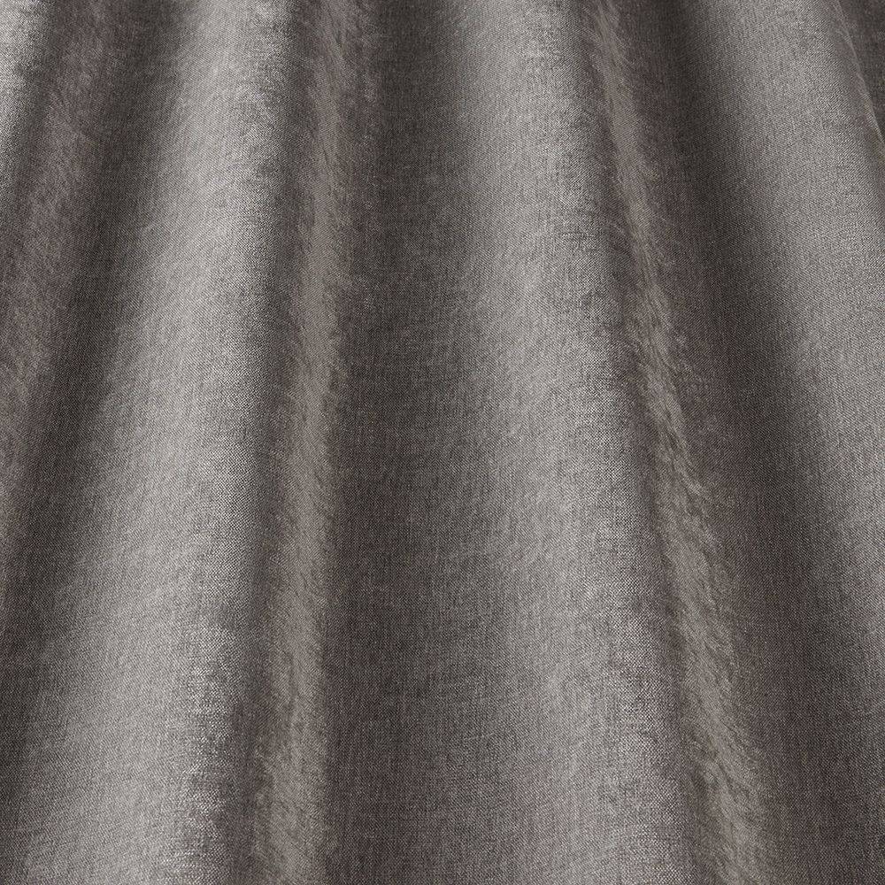 Grosvenor Contract Chenille Fossil fabric draped to show soft, elegant texture, perfect for durable and stain-resistant upholstery projects.
