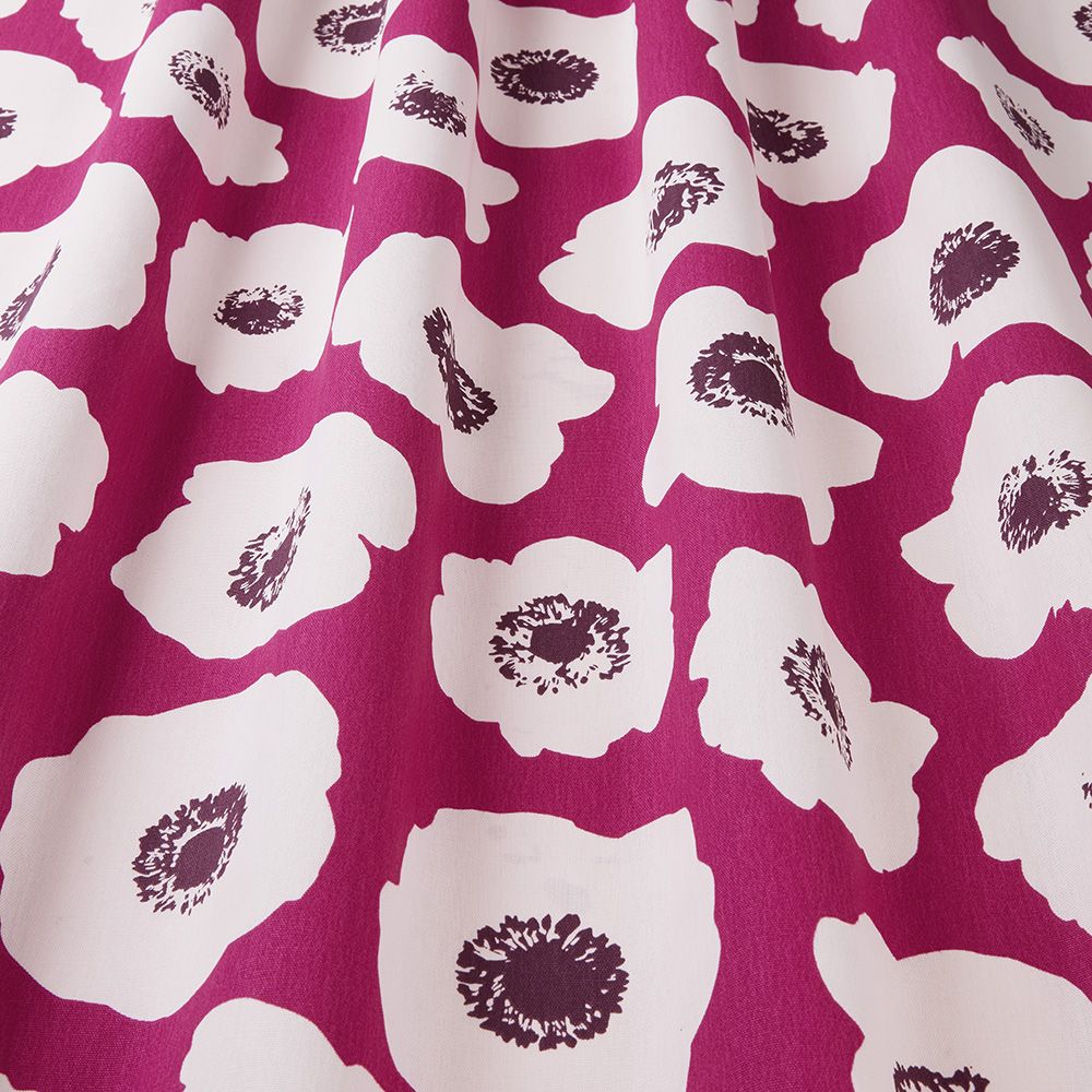 Close-up of Large Poppy Wild Berry Scandi fabric showcasing white floral prints on a vibrant red cotton textile, perfect for creative projects.