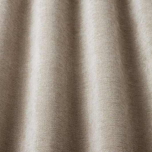 Close-up of Looma Sustainable Woven Driftwood fabric draped to highlight its soft texture and eco-friendly woven finish for curtains.