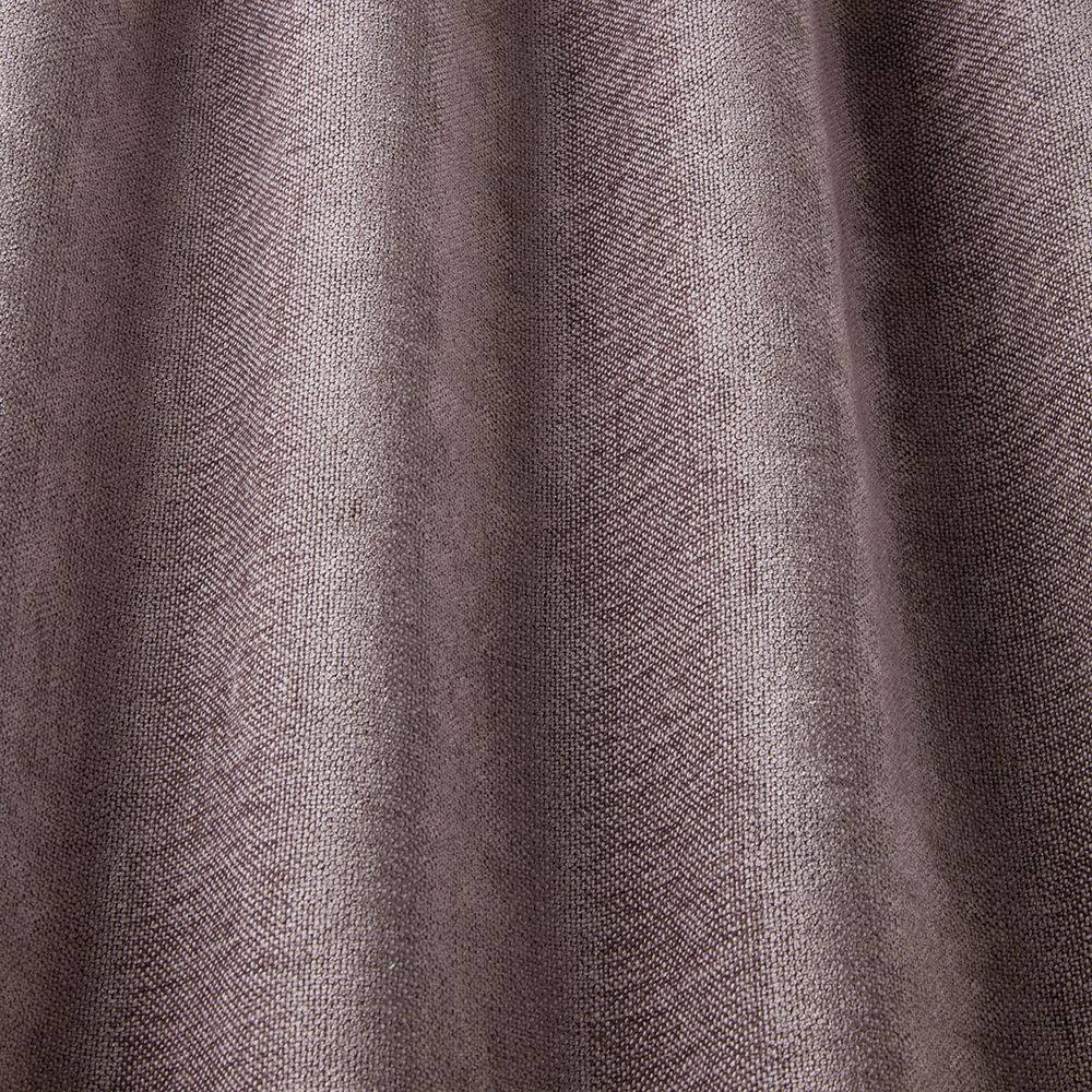 Draped Looma Sustainable Woven Grape fabric highlighting its soft texture and eco-conscious design for stylish home interiors.
