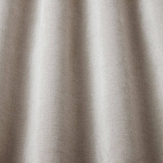 Looma Sustainable Woven Greige fabric draped to show texture and flow, perfect for sustainable curtain and upholstery projects.