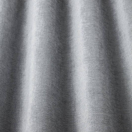 Close-up of Looma Sustainable Woven Storm fabric draped to show texture and flow, perfect for eco-friendly curtain and upholstery projects.