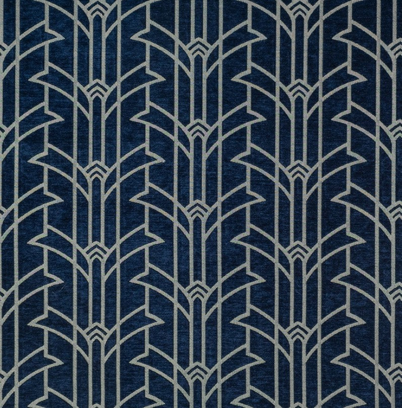 Rhythm Miller Art Deco fabric in luxury chenille with a bold geometric pattern in silver on a deep blue background, ideal for upholstery or décor.