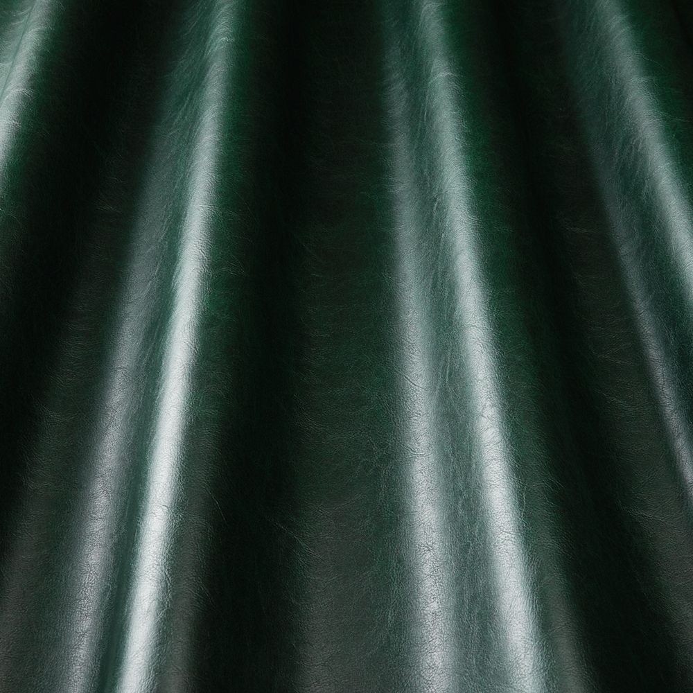 Pommel Contract Emerald durable leather-look vinyl with a rich green hue and smooth draped texture, perfect for waterproof upholstery applications.