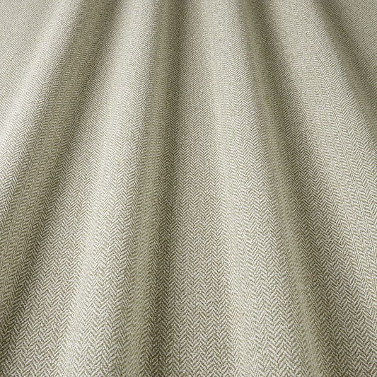 Close-up of textured beige fabric with a subtle pattern