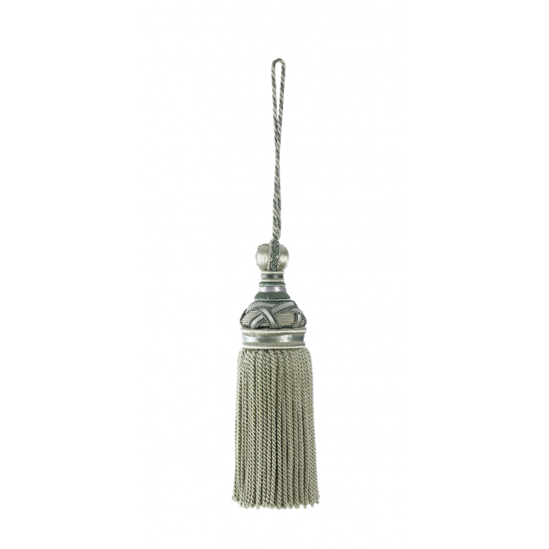Decorative key tassel with metallic finish on a white background