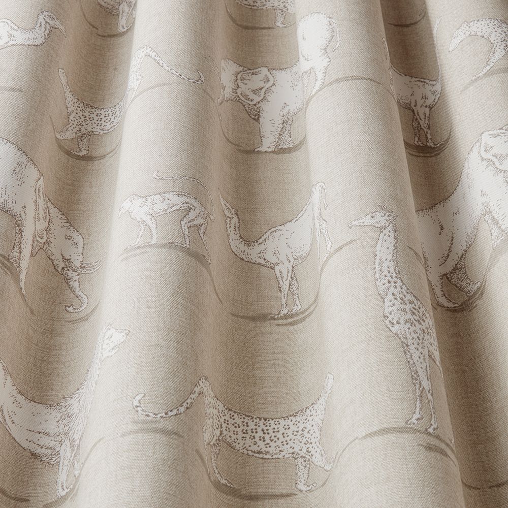 Close-up of African Safari Sand fabric showcasing detailed hand-drawn animal designs on soft beige cotton material for upholstery.