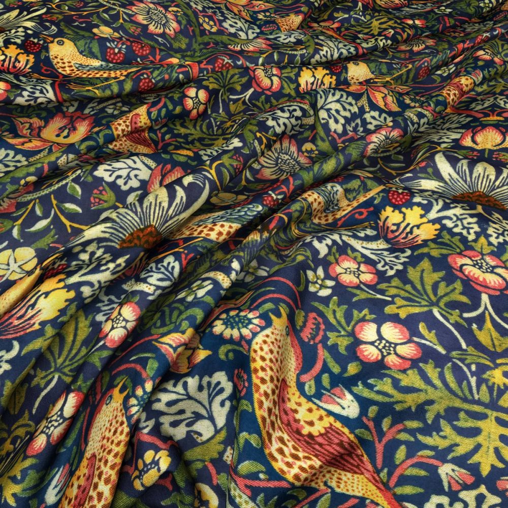 Close-up of William Morris Velvet Strawberry Thief Cobalt fabric showcasing detailed bird and floral designs on a soft, luxurious velvet texture.
