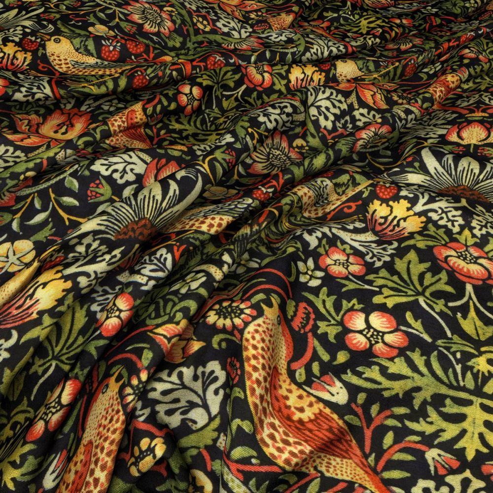Close-up of William Morris Strawberry Thief Velvet Fabric in Ebony with vibrant floral and bird motifs, perfect for arts and crafts projects.