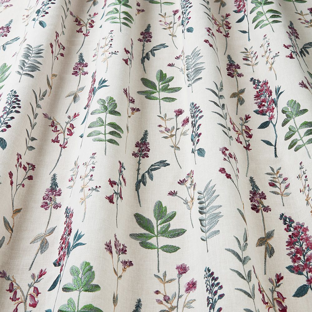 Detailed view of Wild Flora Rosella fabric with embroidered floral designs, perfect for home décor like curtains and blinds.