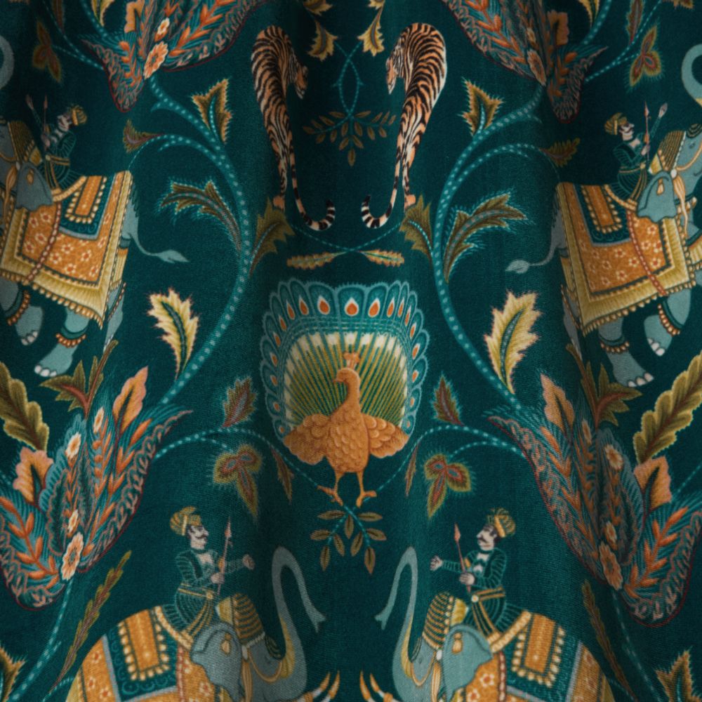 Close-up of Yamuna Velvet Fabric Emerald showcasing detailed Indian-inspired designs with elephants, tigers, and peacock motifs in rich colours.