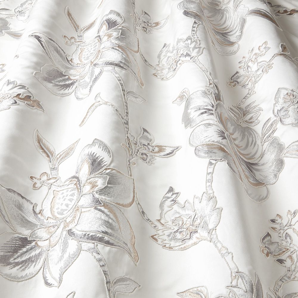 Close-up of Renaissance Florence Champagne fabric showcasing luxurious floral embroidery with shimmering velvet details, perfect for crafting and upholstery.