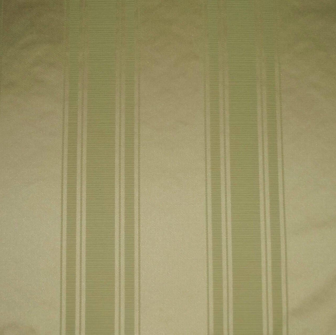 Close-up of green striped fabric with a subtle pattern