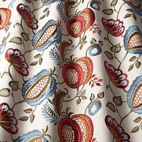 Arbor Vine Indigo fabric with intricate arts and crafts embroidery featuring red, blue, and green floral patterns on a cream background, ideal for curtains.