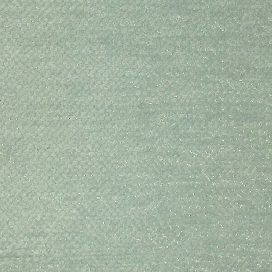 A close-up of a light sage green textured fabric with a subtle woven pattern.