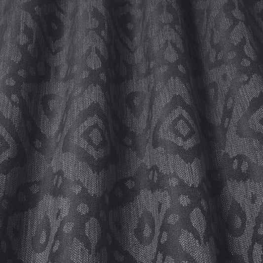 Axum Woven Jacquard Anthracite fabric with intricate Ikat-inspired patterns in charcoal tones, ideal for upholstery and home decor.