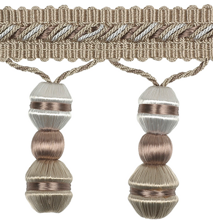 Decorative trim with braided design and spherical beads on a white background