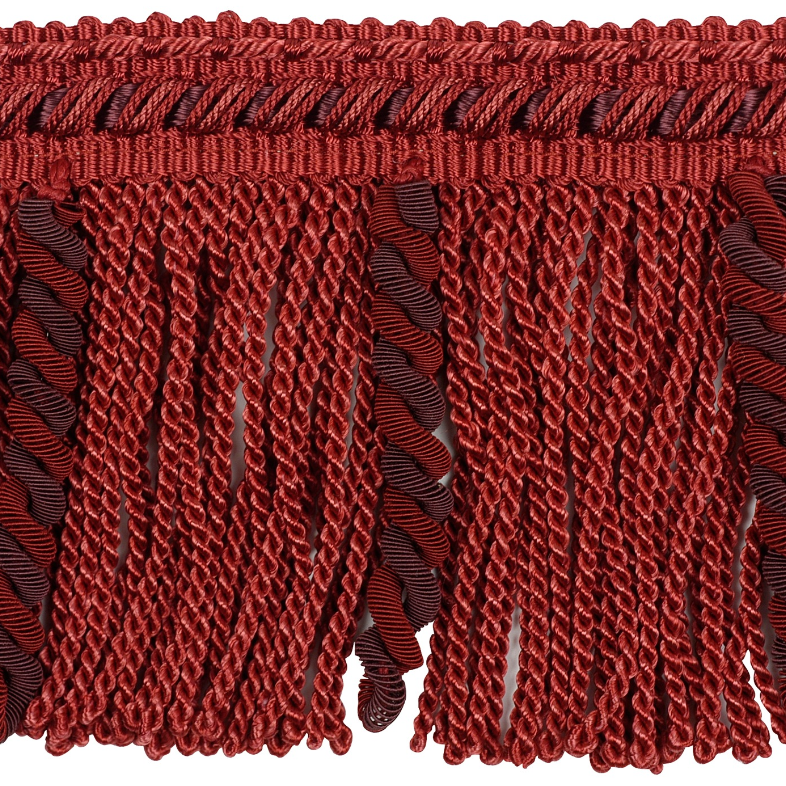 Close-up of red fringe fabric on a white background