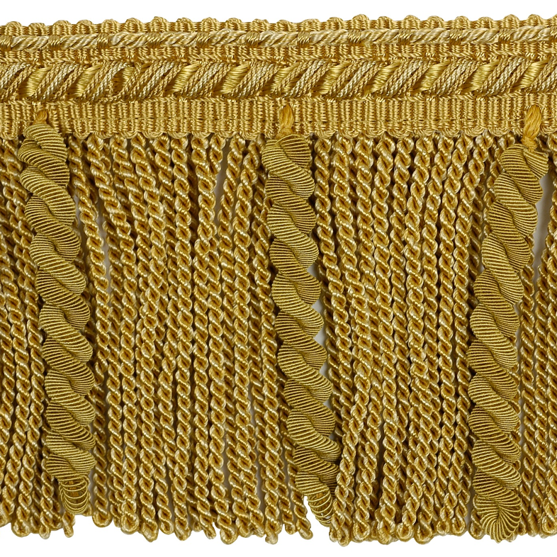 Gold fringe fabric trim on a white background