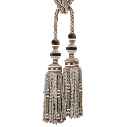 Decorative tassel tieback with metallic finish on a white background