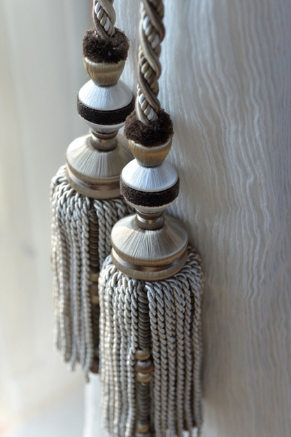Decorative tassel tieback with braided design against a neutral background