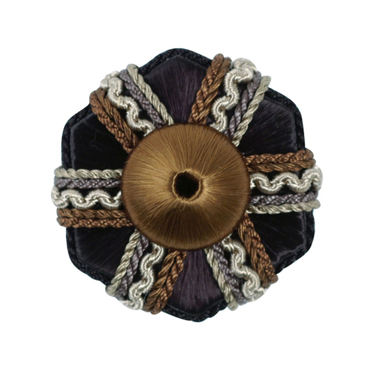 Decorative black rosette with brown centre and braided trim on a white background