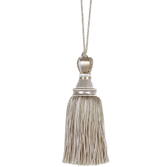 Decorative key tassel with metallic finish on a white background