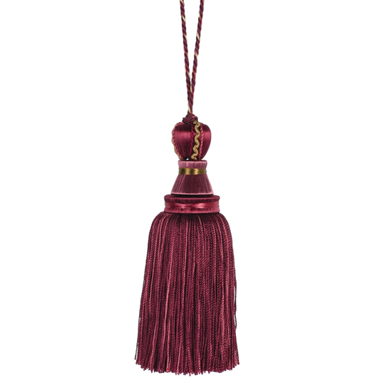 Mulberry key tassel with a gold accent on a white background