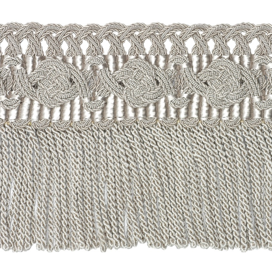 Decorative lace trim with intricate patterns on a textured fabric background