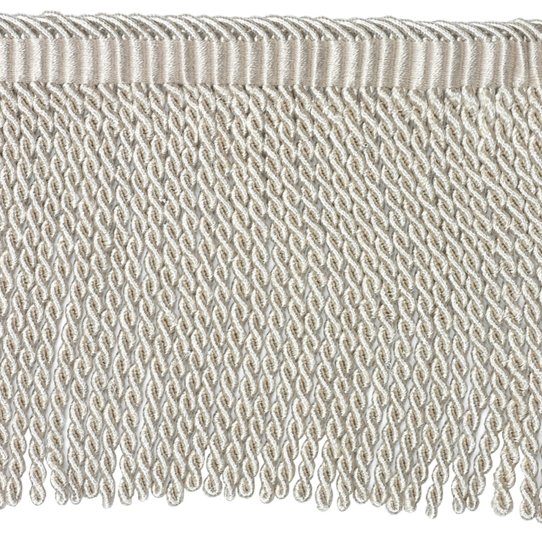 Close-up of textured bullion fringe trim detail on a white background