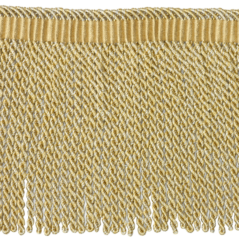 Close-up of gold fabric fringe on a white background