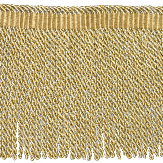 Close-up of gold fabric fringe on a white background