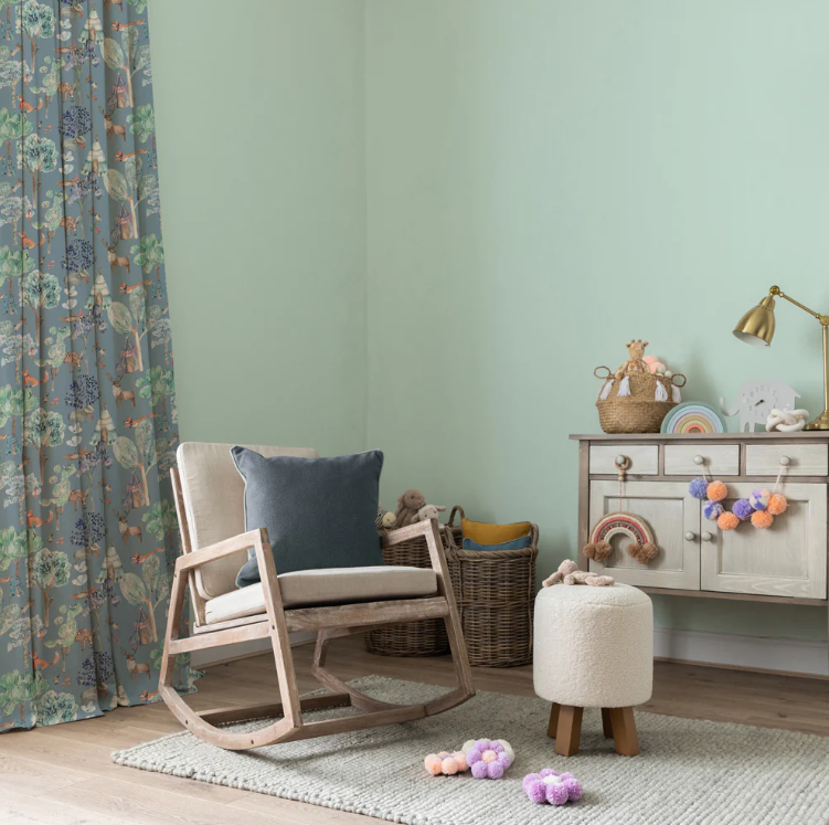 Kids' bedroom styled with junior forest fabric denim curtains featuring woodland animal print, paired with pastel decor and cozy furniture.