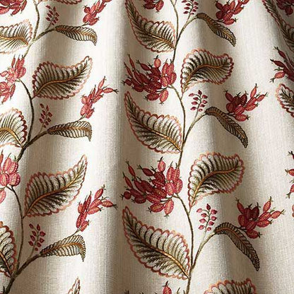 Close-up of Climbing Fruitlet Ruby fabric showcasing detailed red floral embroidery and green leaves, perfect for curtains and creative crafting.