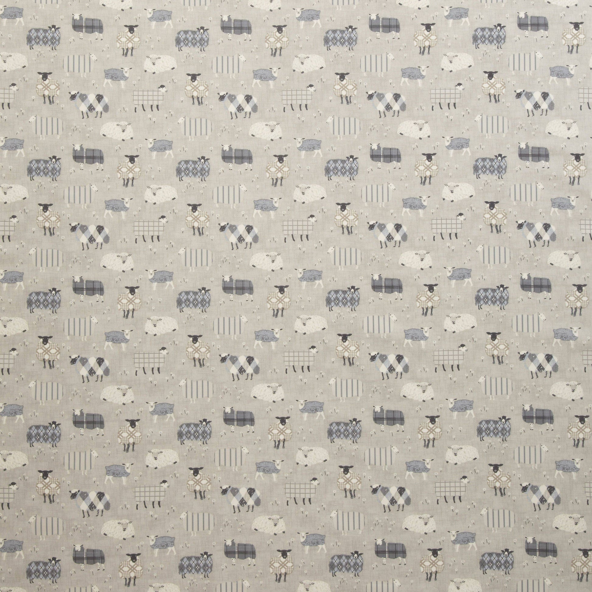 Grazing Pastures Charcoal animal fabric featuring playful sheep patterns in grey and white, ideal for kids’ rooms curtains or upholstery projects.