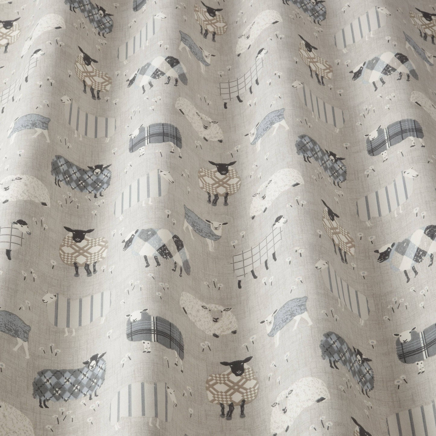 Close-up of Grazing Pastures Charcoal sheep-themed fabric with whimsical designs, perfect for children’s room blinds, curtains, or soft furnishings.