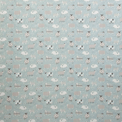 Grazing Pastures Duck Egg animal fabric featuring whimsical sheep patterns on soft blue textile, ideal for kids’ room curtains or upholstery.